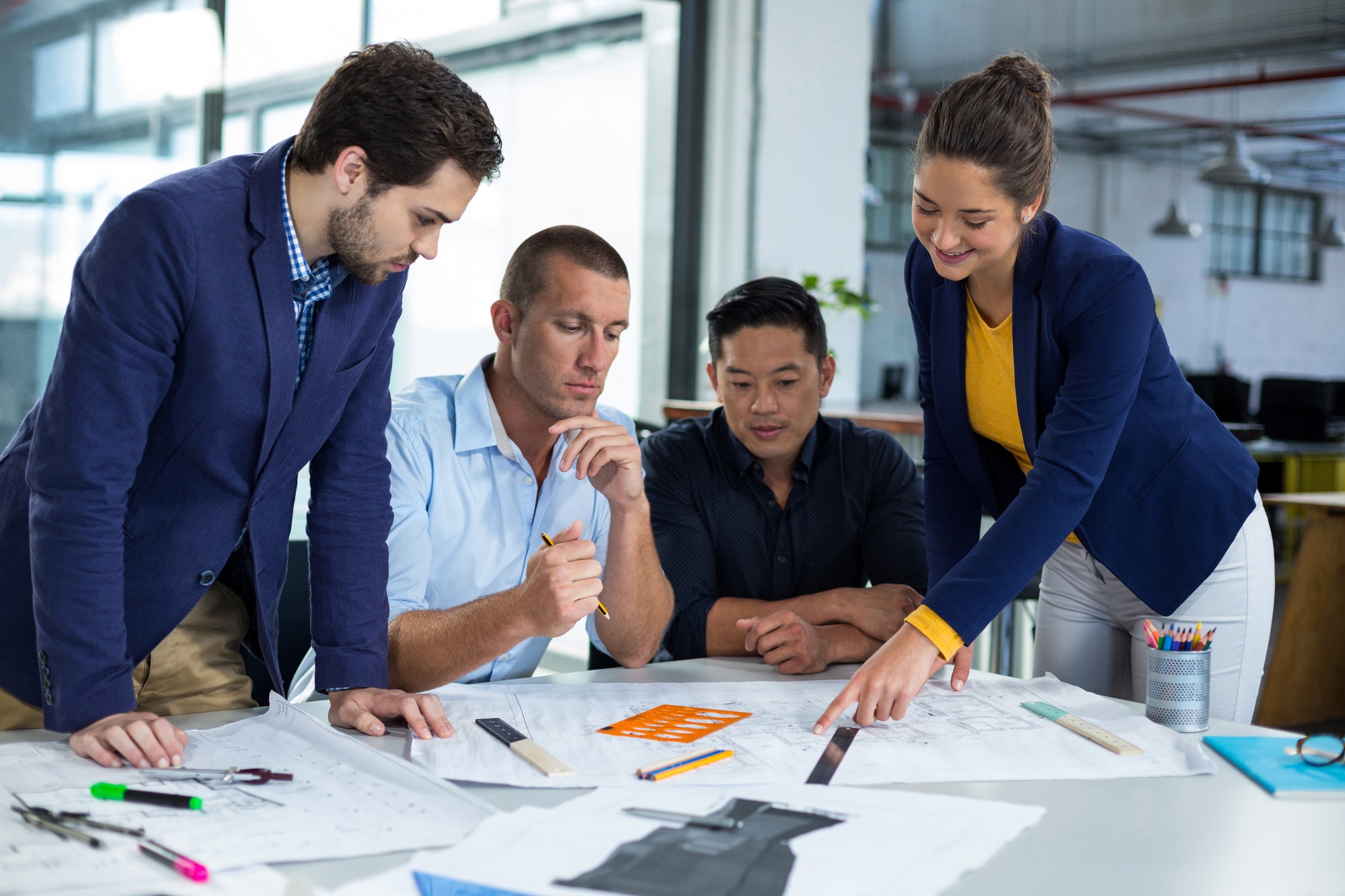 businesspeople-having-discussion-over-document